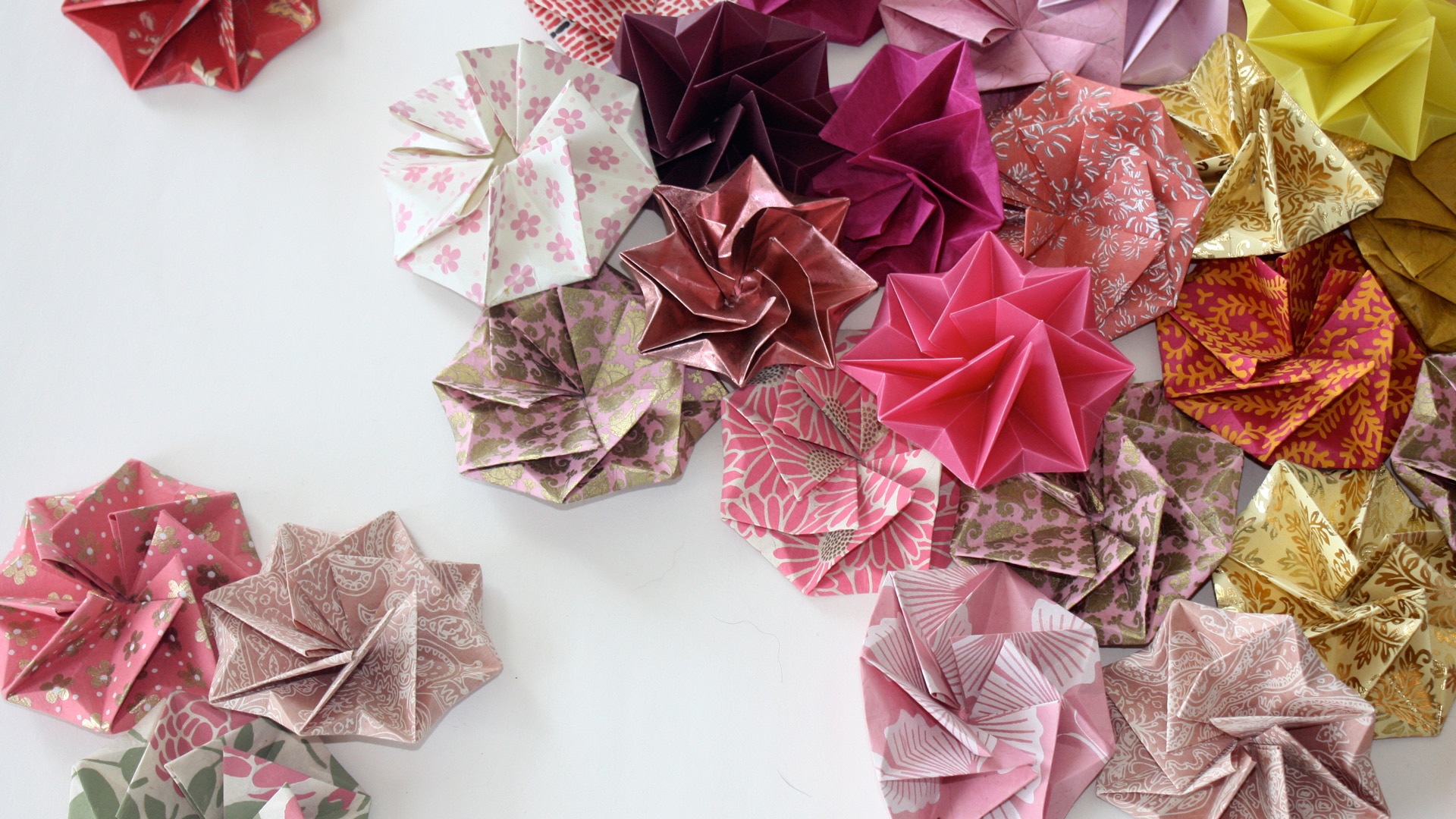 An image of origami paper shapes to demonstrate what can be made in the workshop